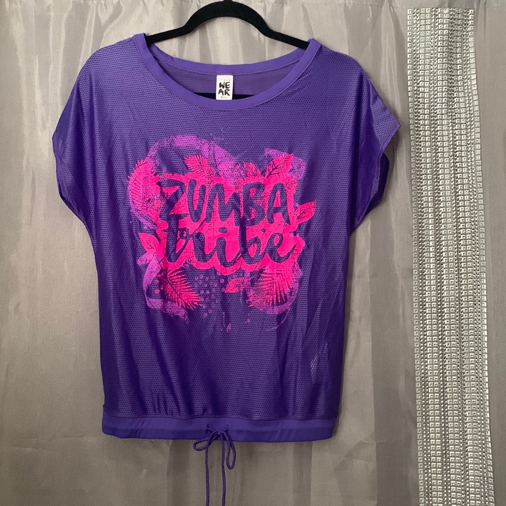 Zumba see through top with adjustable bottom band.